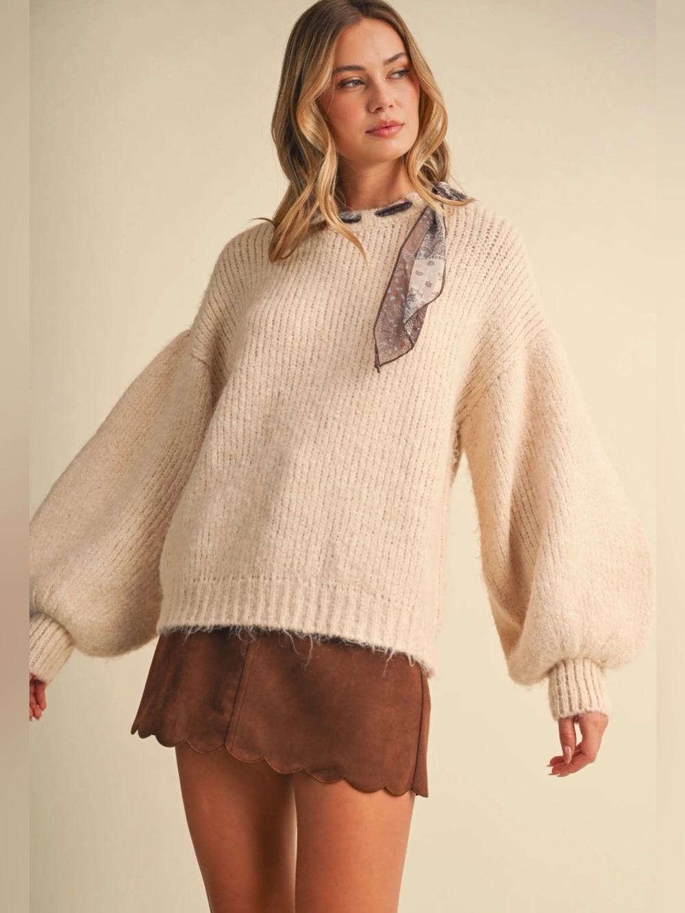 These three cream tan scarf sweater